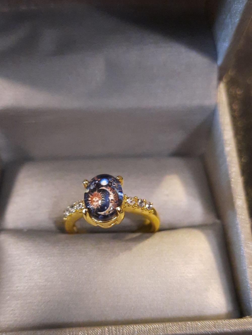 Gold-Tone Galaxy Oval Ring with Blue and Black Stone Size 8